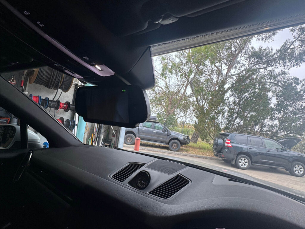 Safety Dave monitor fitted over the factory mirror