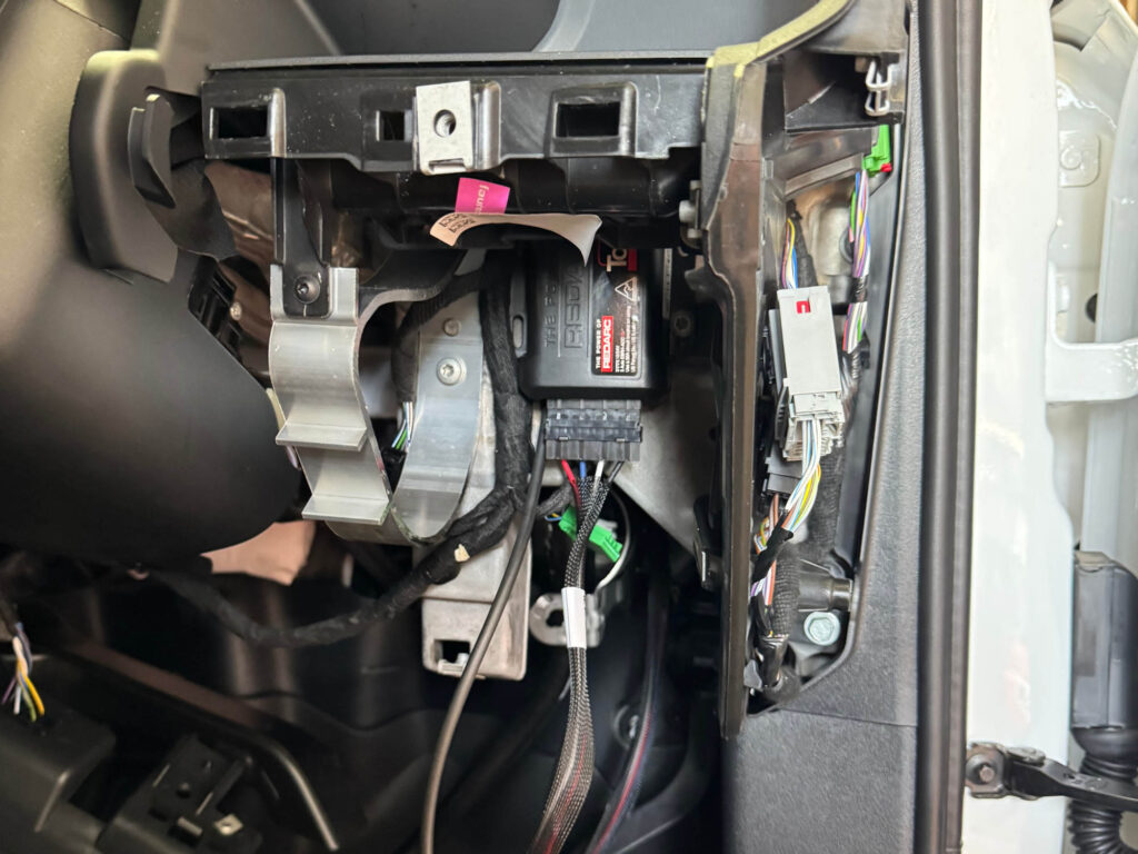 Discrete brake controller interface in factory trim