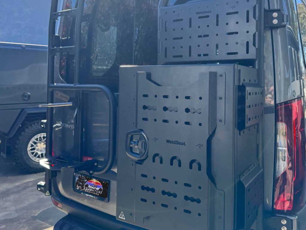 A secure WeldBeat storage box mounted to the cargo carrier, featuring integrated mounting points and a lockable handle for gear protection
