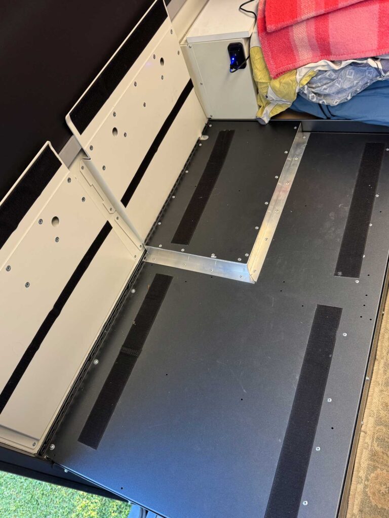 The modified internal housing is prepared with velcro strips to secure the high-density mats