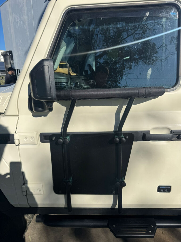 The padded shooting rest frame mounts directly onto the exterior door tracking system without requiring body alterations
