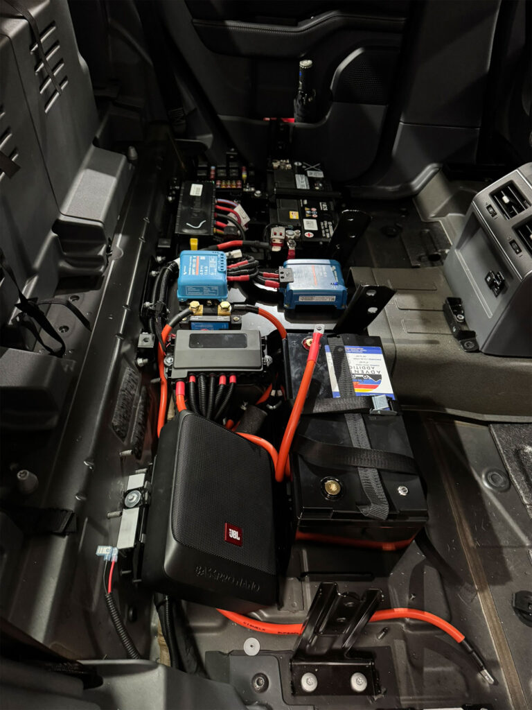 The finished electrical layout contains the lithium battery, charging regulators, and safety fuses arranged cleanly