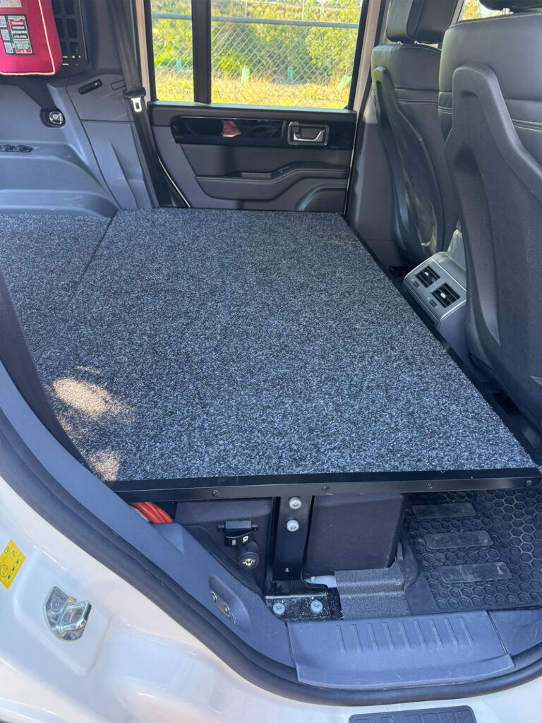 Durable carpeted deck replacing the rear passenger seating