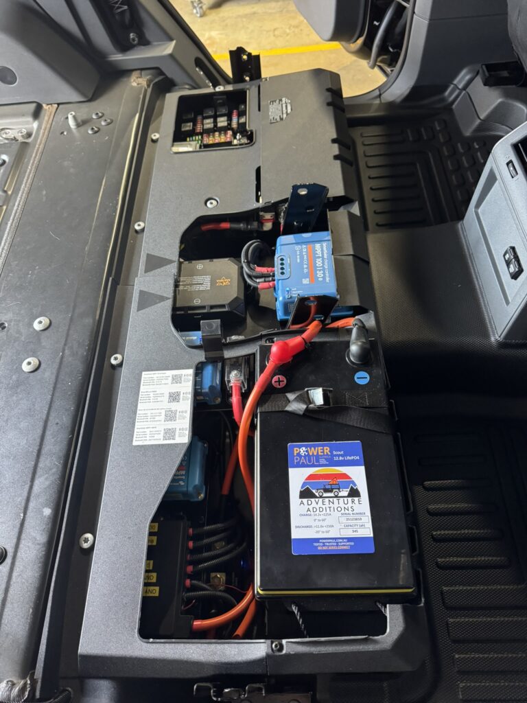 Lithium battery and Victron components secured under the floorboard