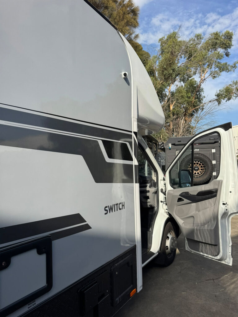 Side view showing professional camera mounting above cabin door
