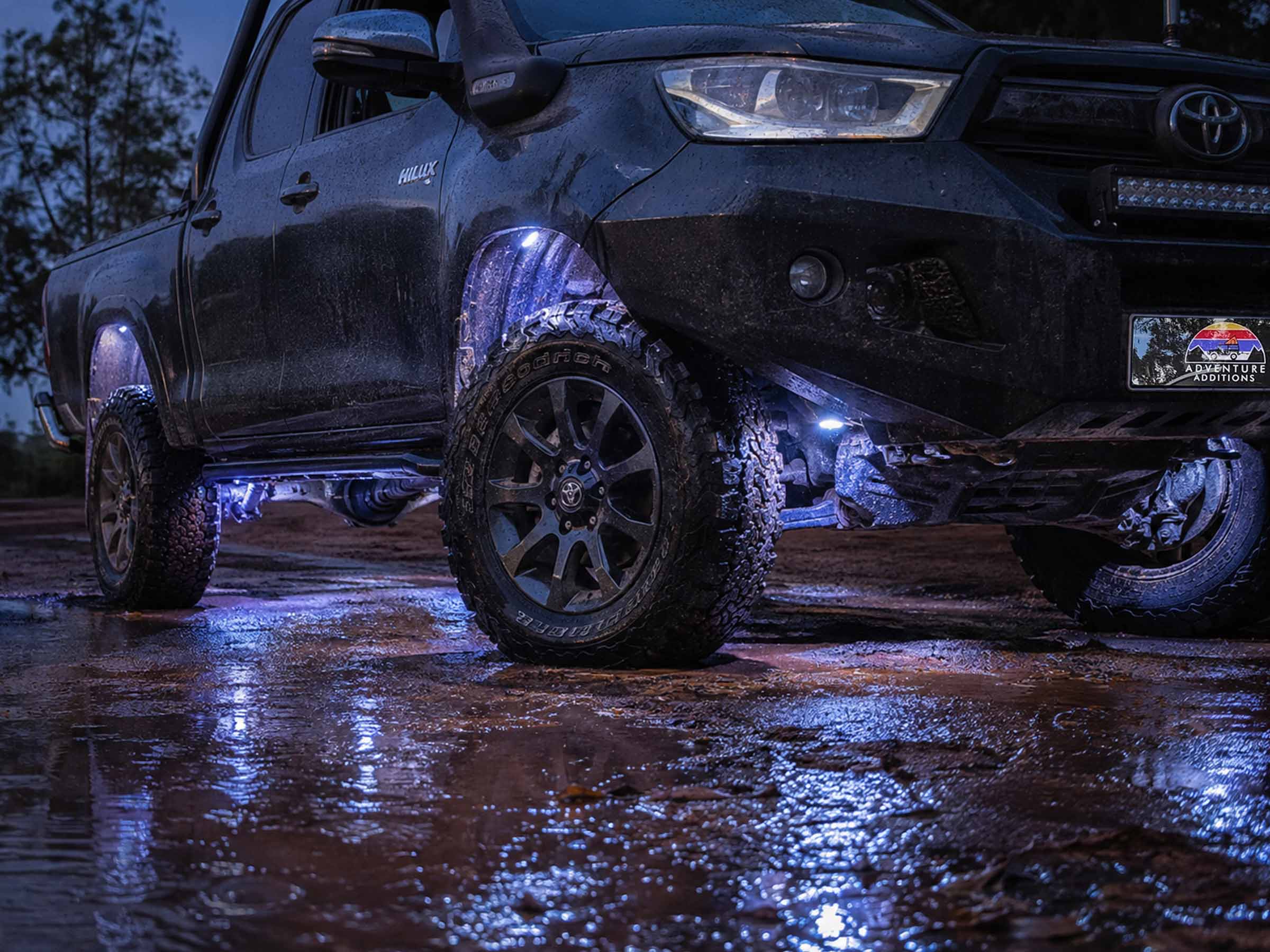 Waterproof housings suited to underbody exposure dust and road spray
